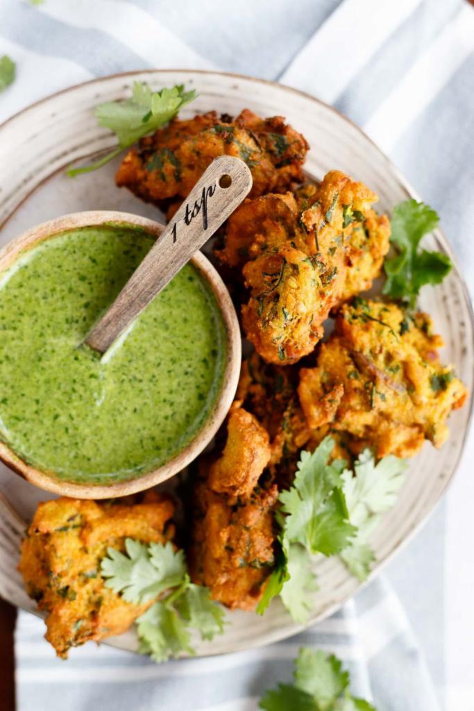 Vegetable Pakora · Crispy fritters of carrots, potatoes, onions, cauliflower and cottage cheese.