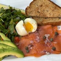 Deluxe Smoked Salmon Platter · Locally smoked, small salad, capers, red onions, dill pickles, avocado, 12 grain toast