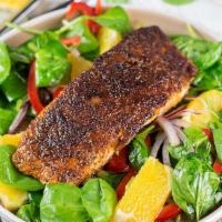 Blackened Salmon Salad · Atlantic salmon over organic mixed greens, avocado, tomatoes, red onions, carrots, cucumbers...