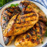 Marinated Organic Chicken Breast Side · Marinated with thyme, lemon hints, garlic, parsley.