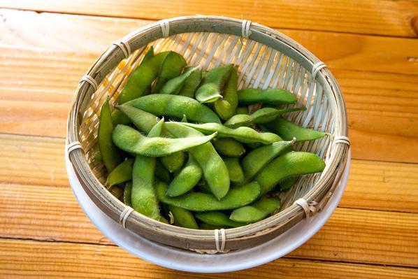 Edamame · Steamed green soybeans served with yuzu salt.