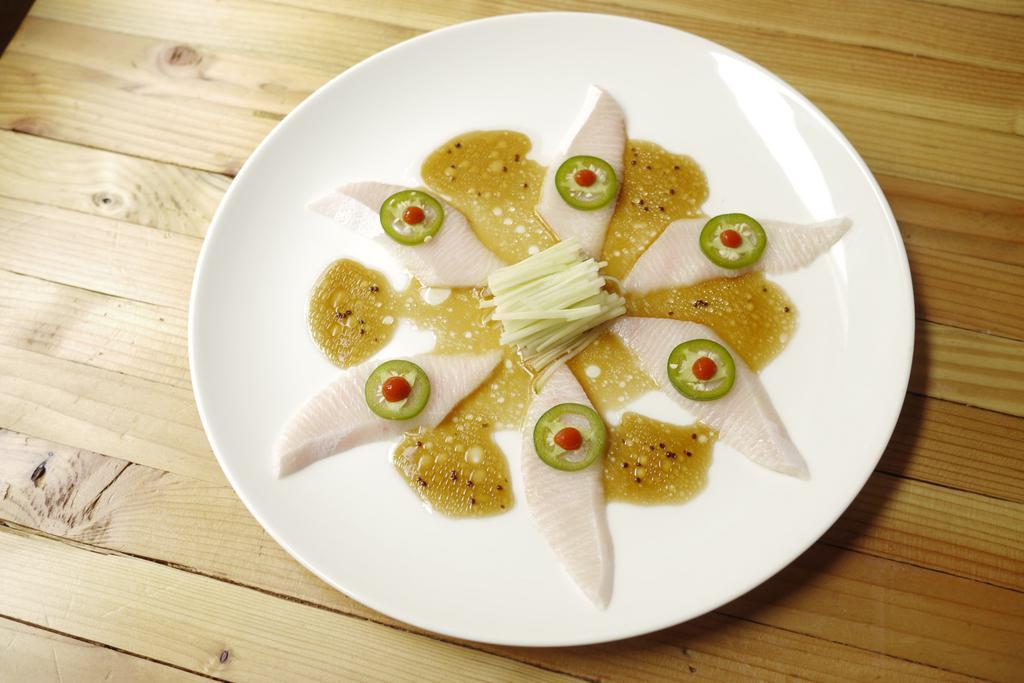 Yellowtail Jalapeno · Sliced yellowtail with jalapeno tobiko, served in wasabi yuzu sauce.