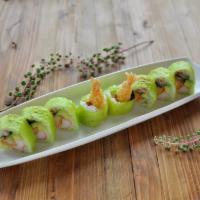 Green Fuji · spicy crabmeat, shrimp tempura, eel & avocado wrapped in green- soybean seaweed & eel with s...
