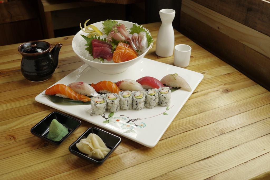 Sushi and Sashimi Entree · 12 pieces assorted sashimi, 6 pieces assorted sushi and California roll. Served with side.