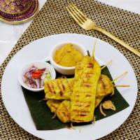 9. Satay · 4 skewers. Marinated and grilled chicken or grilled beef on skewers with side of peanut sauc...