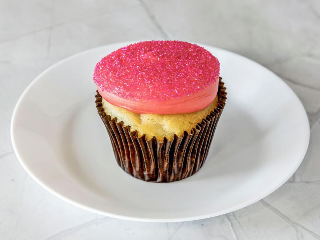 Pink Vanilla Cupcake · Vanilla cake frosted with pink buttercream topped with pink sanding sugar.