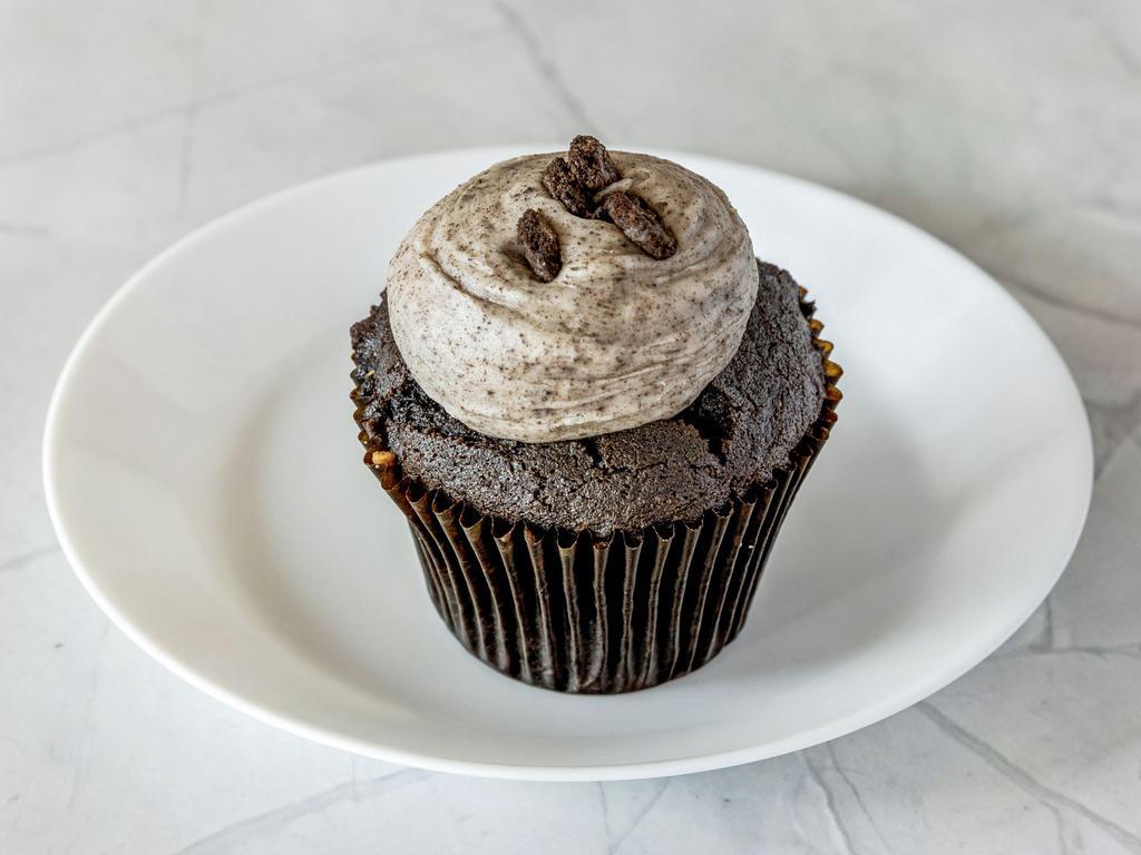 Cookies and Cream Cupcake · Chocolate cake frosted with oreos buttercream topped with crushed oreos.