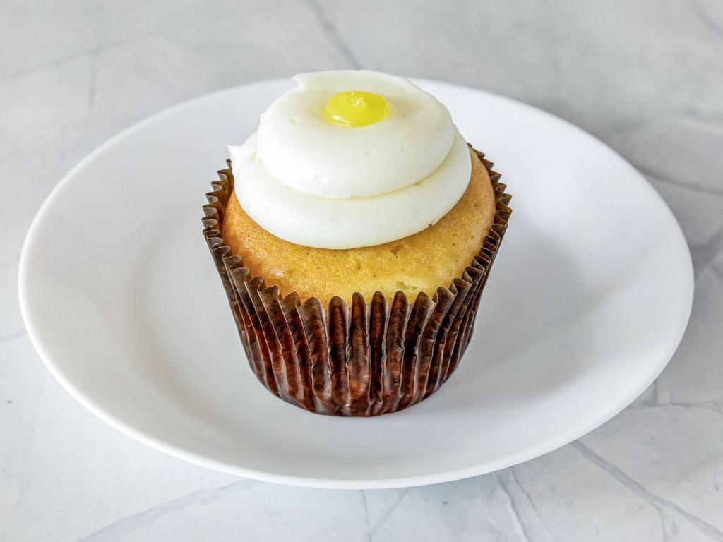 Lemon Drop Cupcake · Vanilla cake filled with lemon filling, lemon buttercream frosting on top with a lemon drop on top.