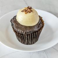 Peanut Butter Cupcake · Chocolate cake frosted with peanut butter cream cheese topped with crushed reeses peanut but...