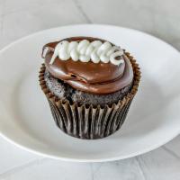 Chocolate Creme Cupcake · Chocolate cake filled with buttercream frosted with fudge topped with buttercream.