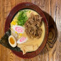 B. Umami Miso Ramen · Miso ramen is flavored with soybean paste (miso), resulting in a thick, brown soup with a ri...