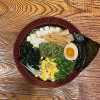 E. Umami Miso Veggie Ramen · vegetable broth.    kale (green) noodle.    Tofu, green onion, bamboo, bean sprout, nori, co...