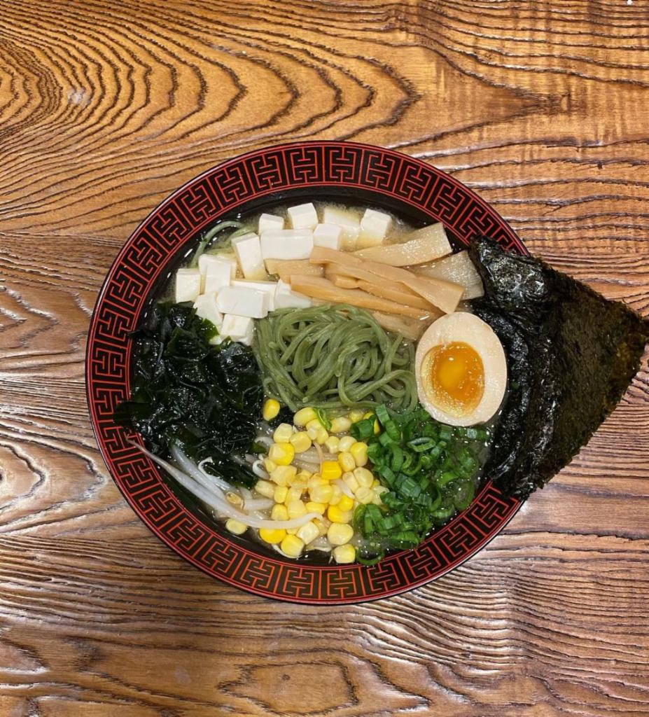 E. Umami Miso Veggie Ramen · vegetable broth.    kale (green) noodle.    Tofu, green onion, bamboo, bean sprout, nori, corn, egg.