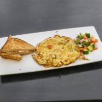 Spanish Omelet · Omelet with roasted tomatoes and green olives.