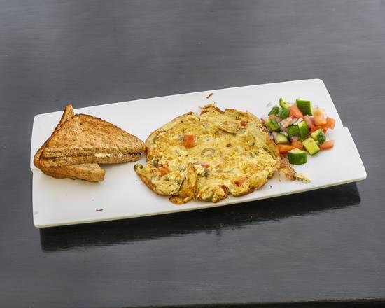 Spanish Omelet · Omelet with roasted tomatoes and green olives.