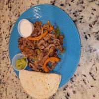 Fajitas · Beef, chicken or shrimp fajitas cooked with onions and bell peppers sides served with corn o...