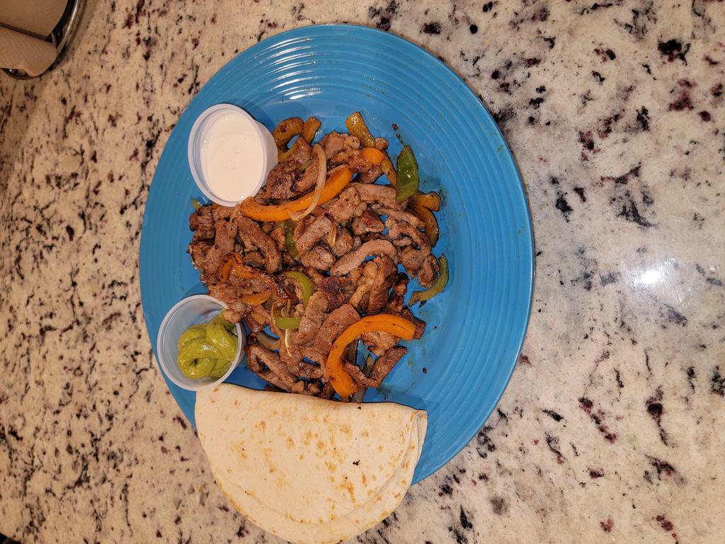 Fajitas · Beef, chicken or shrimp fajitas cooked with onions and bell peppers sides served with corn or flour tortillas, sour cream, beans, and guacamole.