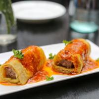 A14 Eggplant Rolls  · Stuffed with spiced beef.