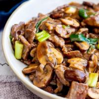 72. Beef with Mushrooms · Served with rice. 
