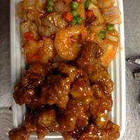 S15. Dragon and Phoenix · One side is General Tso's chicken, the another side is hot and spicy shrimp. Served with ric...