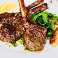Lamb Chops · Served with salad, potato, and vegetable.