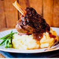 Lamb Shank · Served with mashed potato and vegetable.