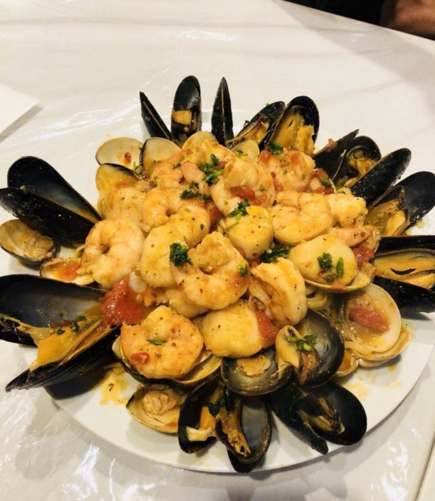 Bocconini Seafood Medley · Scallops, shrimp, calamari, mussels & clams over spaghetti with your choice of sauce.