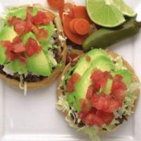 Sopes · 2 sopes with your choice of meat, refried beans, tomatoes, mozzarella cheese, lettuce and av...
