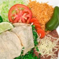 Gorditas Plate · Two gorditas contains: thick tortilas filled with meat, cilantro, onion. The side: Rice, bea...