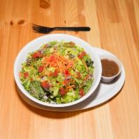 House Salad · Spring mix, romaine, red onion, shredded carrots, and tomatoes.