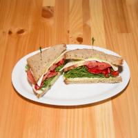 Modern Caprese Sandwich · Fresh Mozzarella, tomatoes, arugula, and roasted peppers (served hot or cold). Add avocado f...