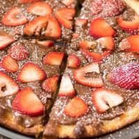 Strawberry Nutella Pizza · Fresh strawberries top a flakey pizza crust with creamy nutella.