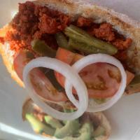 Torta de chorizo · Mexican sausage Mexican sandwich with avocado, onion, beans, tomato, and mayonnaise.