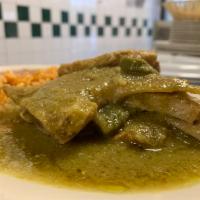 Chuletas en salsa verde  · Pork chops in green sauce with sliced cactus (nopales). Salsa verde made with green tomatoes...