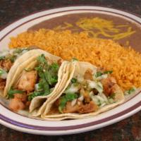 #1. Taco Plate · Three tacos served with rice and beans.
