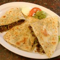 4. Quesadilla · Flour tortillas, cheese, lettuce, onions, cilantro, salsa, choice of meat.