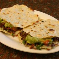 9. Two Mulitas · Corn tortillas, cheese, guacamole, choice of meat, onions, cilantro, salsa.