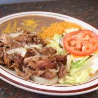 Pork Carnitas · Fried pork plate served with salad, rice, beans and tortillas.