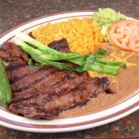 Carne Asada · Carne asada, rice, beans, salad and tortillas.