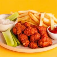 Crispy Buffalo Cauliflower Basket · Our veggie spin on Buffalo wings, served with vegan ranch, ketchup and fries