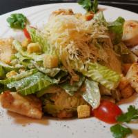 Caesar Salad · A green salad of romaine lettuce and croutons dressed with Caesar dressing. Add chicken, shr...