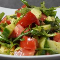 Avocado Salad · Chopped tomatoes, sliced cucumber, sliced red onion, diced avocado, and chopped cilantro int...