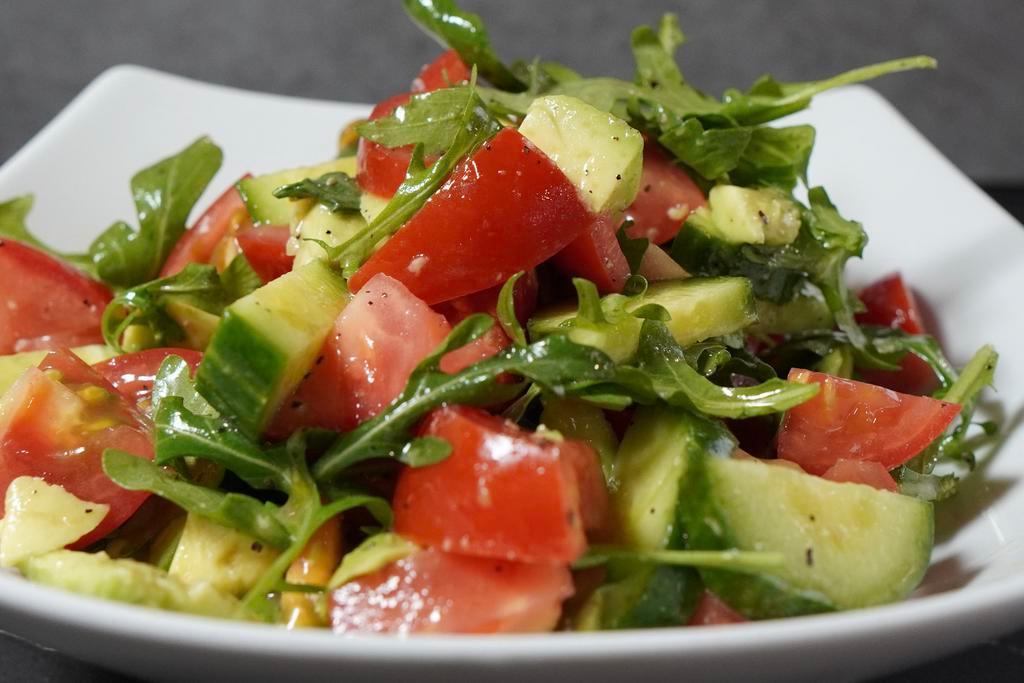 Avocado Salad · Chopped tomatoes, sliced cucumber, sliced red onion, diced avocado, and chopped cilantro into a large salad bowl.