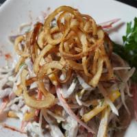 Beef Tongue Salad · Daikon, sliced beef tongue, and mayonnaise toped with caramelized onions.
