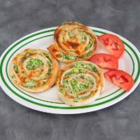 Broccoli Pinwheel · Chopped broccoli with ricotta and mozzarella cheeses tossed together.