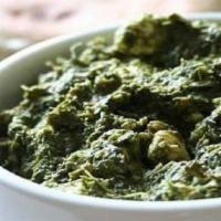 21. Sabji Saag Malai · Spinach cooked with potatoes, eggplant, and cauliflower. Vegan.