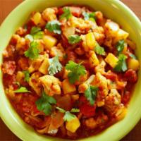 7. Bhuna Gobi Aloo · Cauliflower and potatoes cooked with fresh ginger and tomatoes. Vegan.