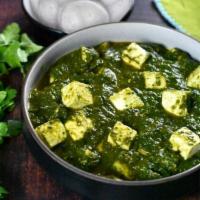 12. Saag Paneer · Homemade cottage cheese cooked with fresh spinach, spices, and tomatoes.