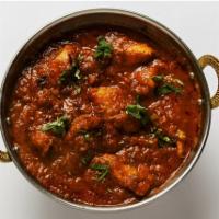 7. Chicken Vindaloo · Goan style chicken cooked with potatoes in a spicy sauce.