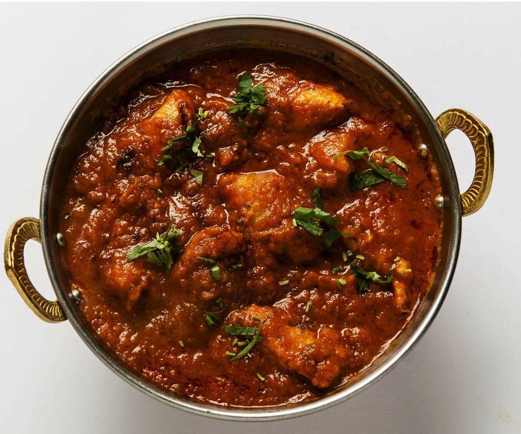 7. Chicken Vindaloo · Goan style chicken cooked with potatoes in a spicy sauce.